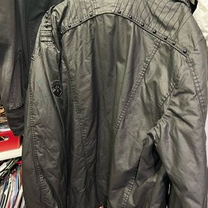 Never worn, great shape. Looks like leather but heavy duty cotton.